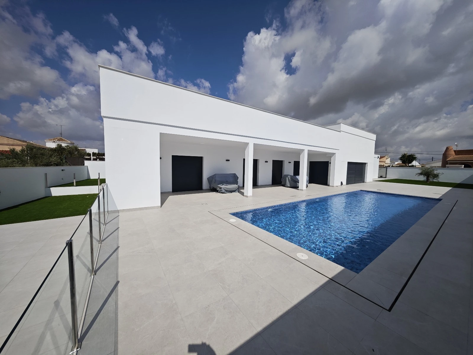 Contemporary white residence with a swimming pool and terrace from Nordic Constructions’ portfolio